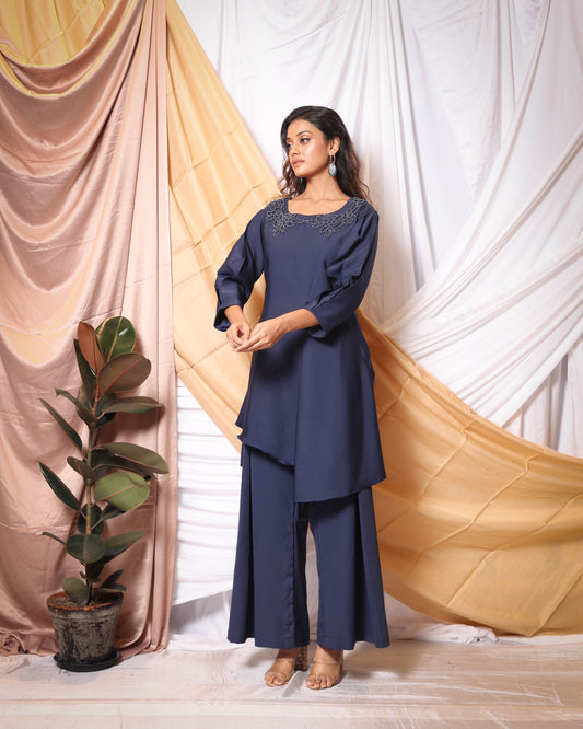 MINIMALIST CUT-WORK EMBROIDERED TUNIC AND FLARED PANTS CO-ORD SET